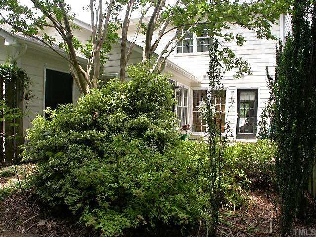 6902 Saxby Court Raleigh, NC 27613 - Photo 12 of 12 This view is from the lawn looking back toward the patio./Storage shed
