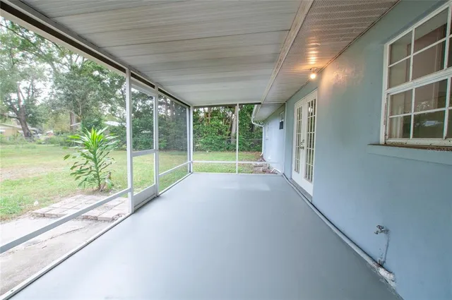 a view of empty room with windows