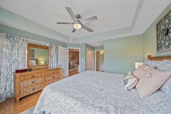 a bedroom with a large bed and a large dresser