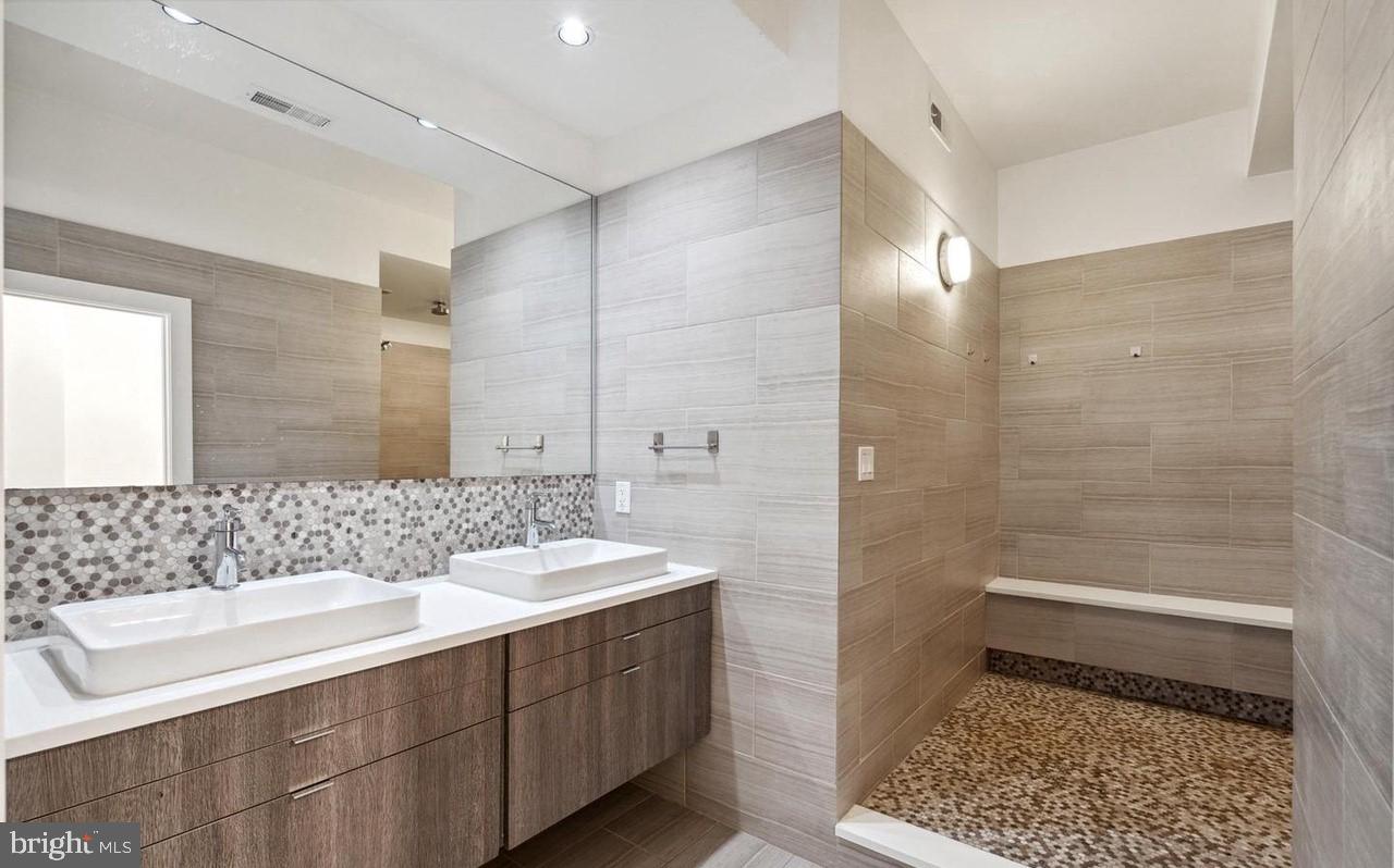 1606 Chestnut Street, Unit 4 Philadelphia, PA 19103 - Photo 18 of 35 a bathroom with a sink a toilet and shower