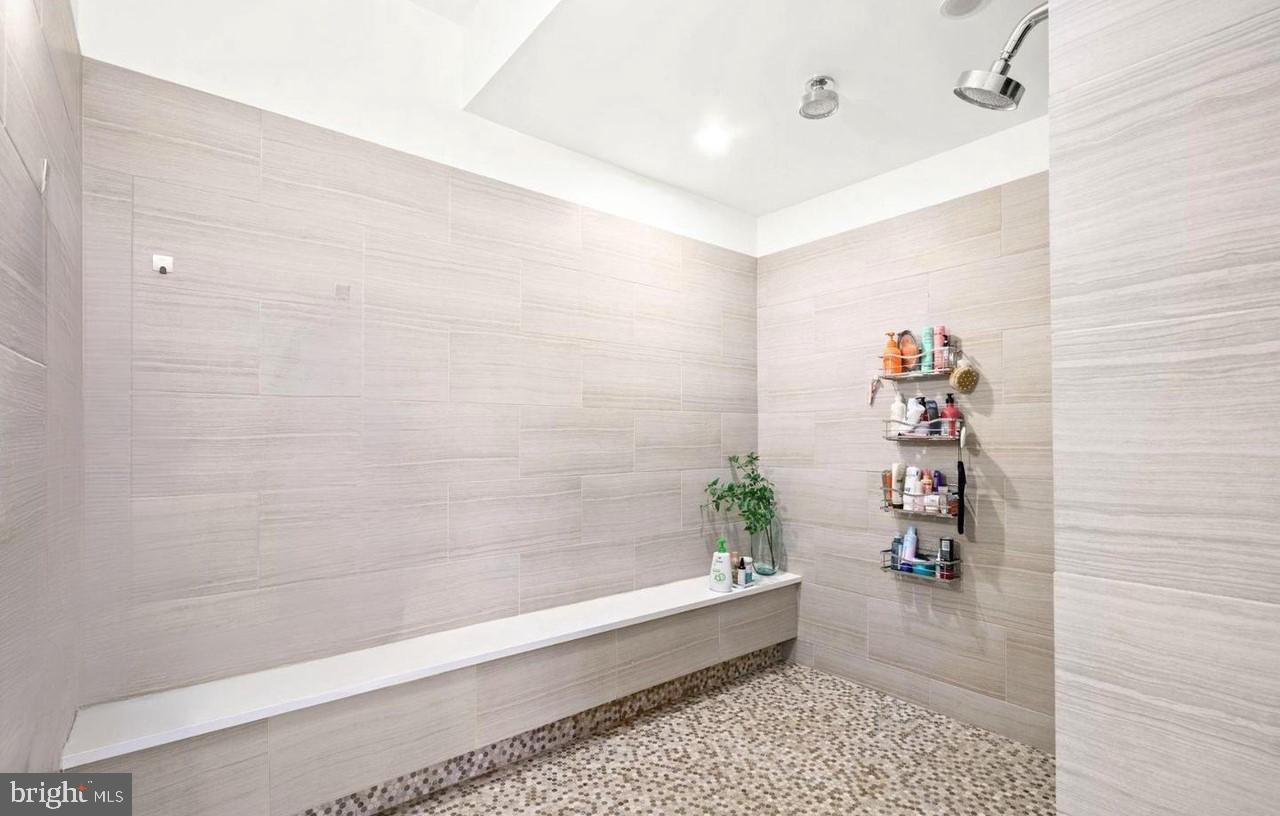 1606 Chestnut Street, Unit 4 Philadelphia, PA 19103 - Photo 19 of 35 a bathroom with a bathtub and a shower