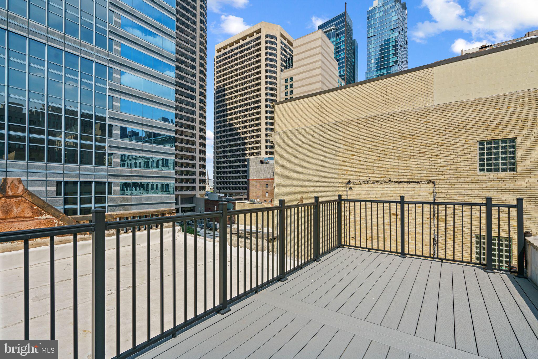 1606 Chestnut Street, Unit 4 Philadelphia, PA 19103 - Photo 34 of 35 a view of a balcony with wooden floor