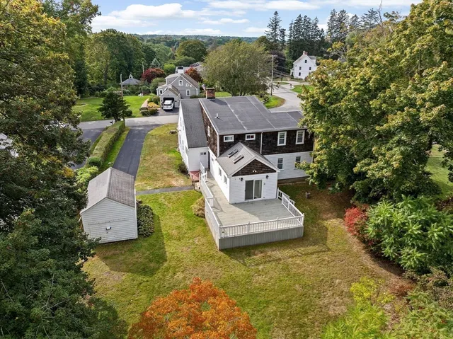 an aerial view of a house with a garden