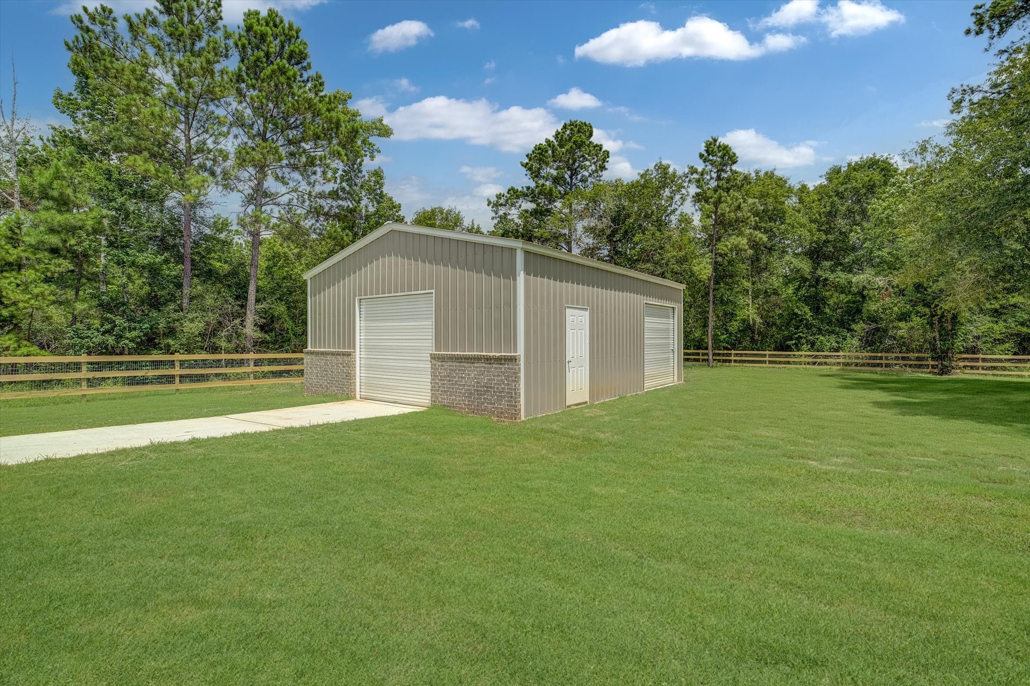 347 Iron Horse Road Willis, TX 77378 - Photo 31 of 49 View of the workshop from back porch