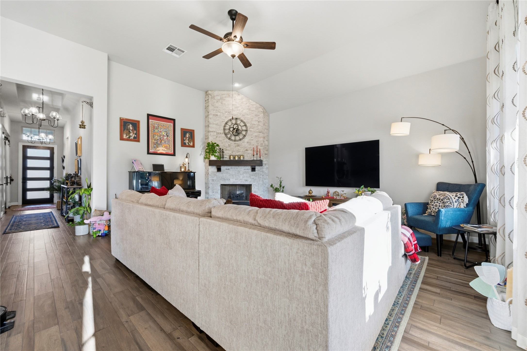 138 Rpd Spgs Cove Georgetown, TX 78628 - Photo 22 of 37 a living room with furniture and a flat screen tv
