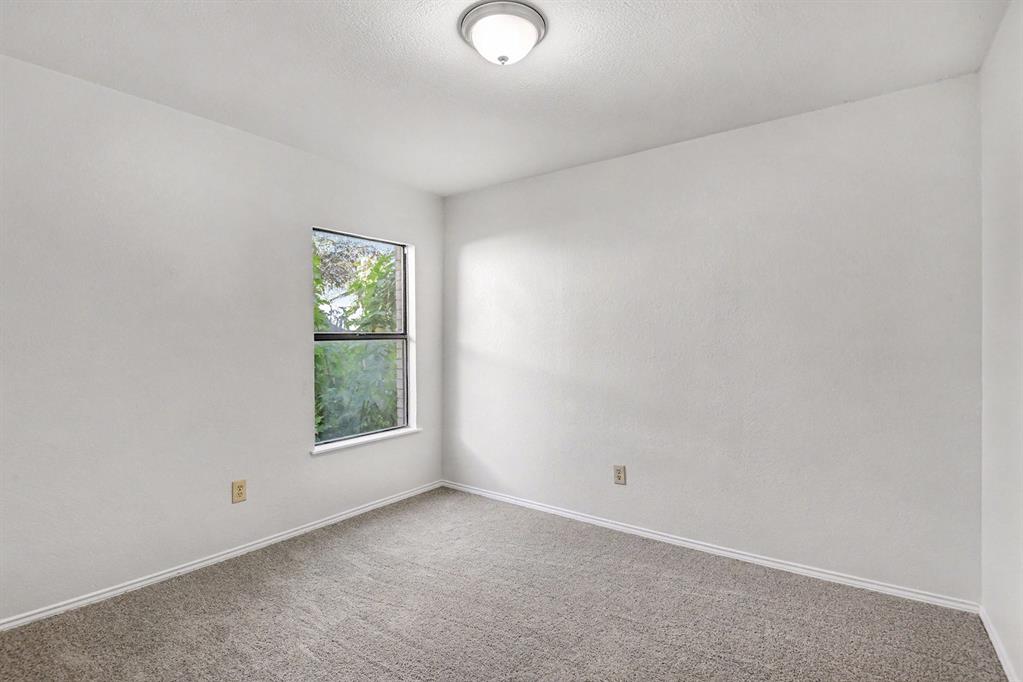 7912 Prairie Drive Watauga, TX 76148 - Photo 11 of 20 an empty room with windows