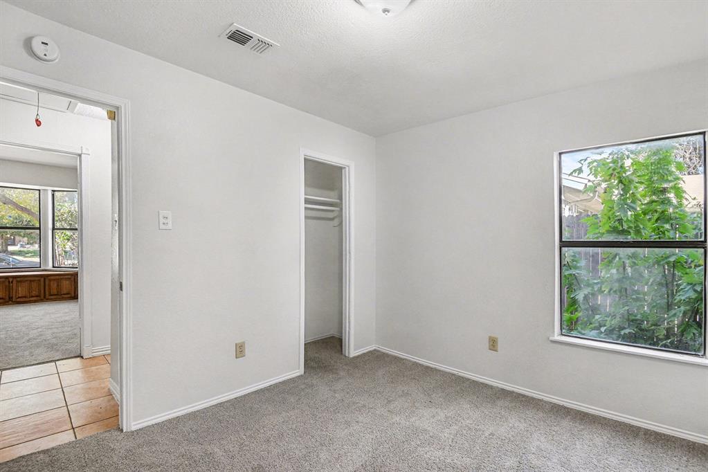 7912 Prairie Drive Watauga, TX 76148 - Photo 12 of 20 an empty room with windows