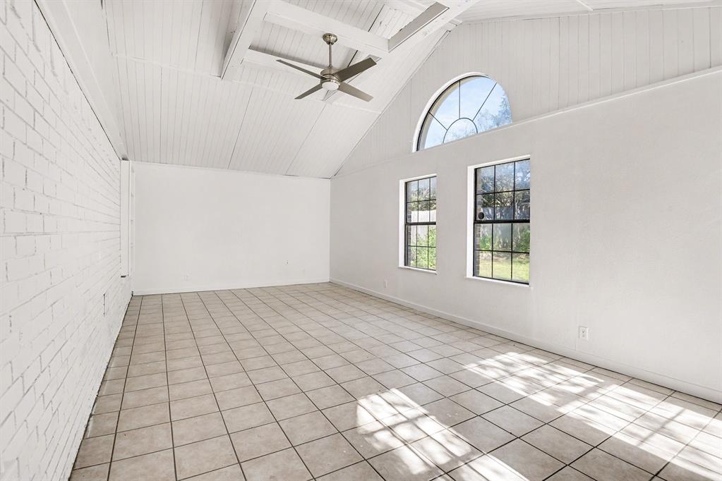 7912 Prairie Drive Watauga, TX 76148 - Photo 17 of 20 an empty room with windows and ceiling fan