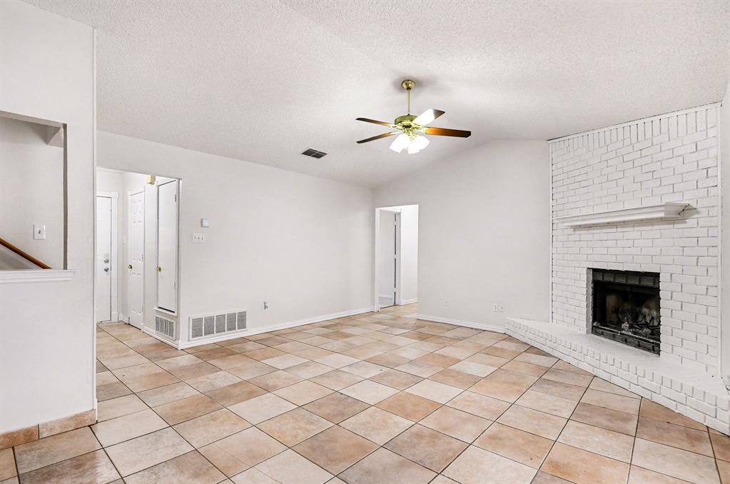 7912 Prairie Drive Watauga, TX 76148 - Photo 5 of 20 a view of an empty room with a fireplace