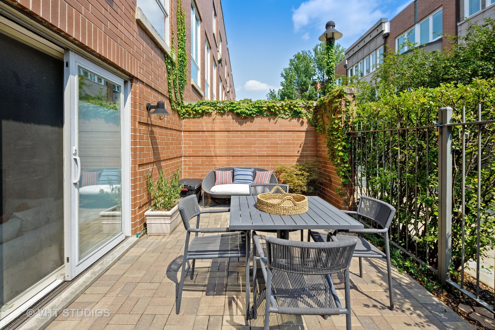 2673 North Greenview Avenue, Unit F Chicago, IL 60614 - Photo 18 of 23 a view of a patio with table and chairs and potted plants