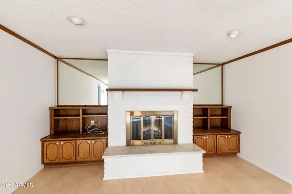 a view of a studio with wooden floor