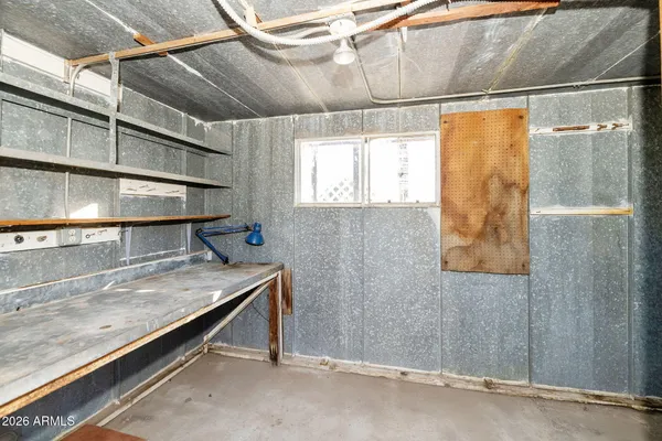 a view of a swimming pool with outdoor seating