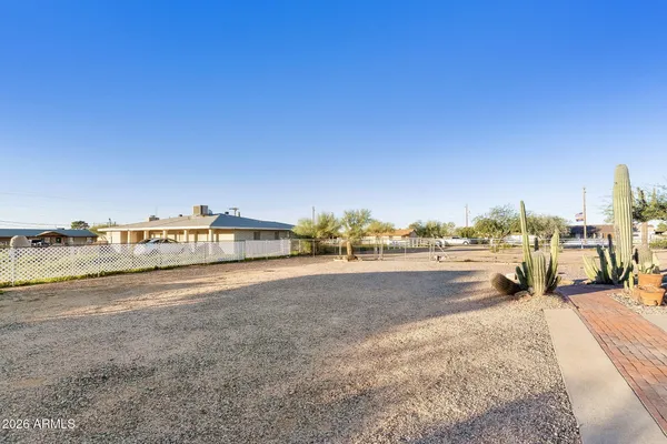 a view of a house next to a yard