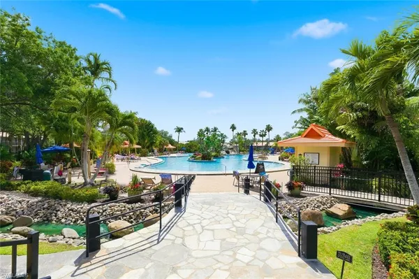 a view of a swimming pool and lounge chair
