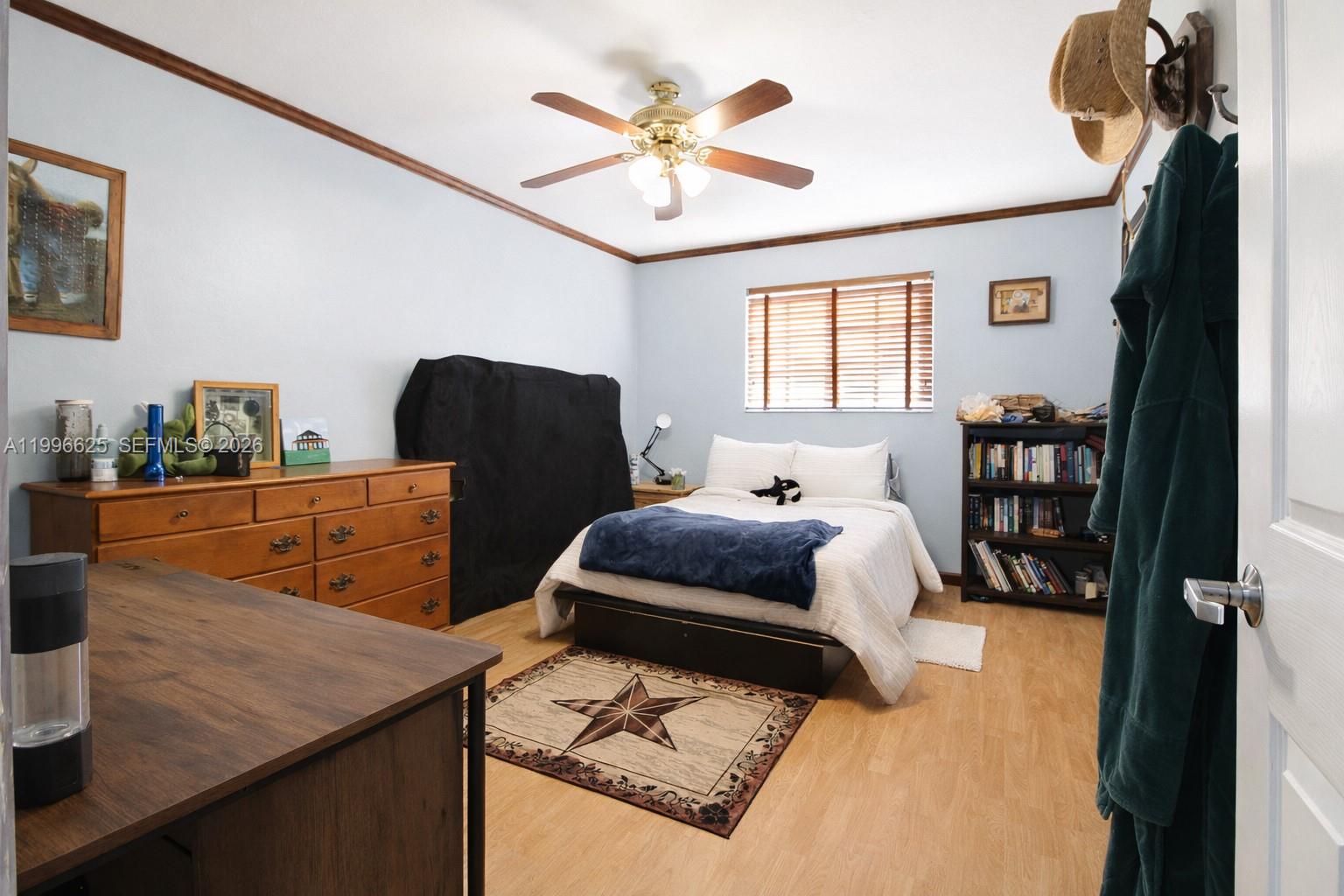 27420 Southwest 165th Avenue Homestead, FL 33031 - Photo 15 of 35 a bedroom with furniture and a large window