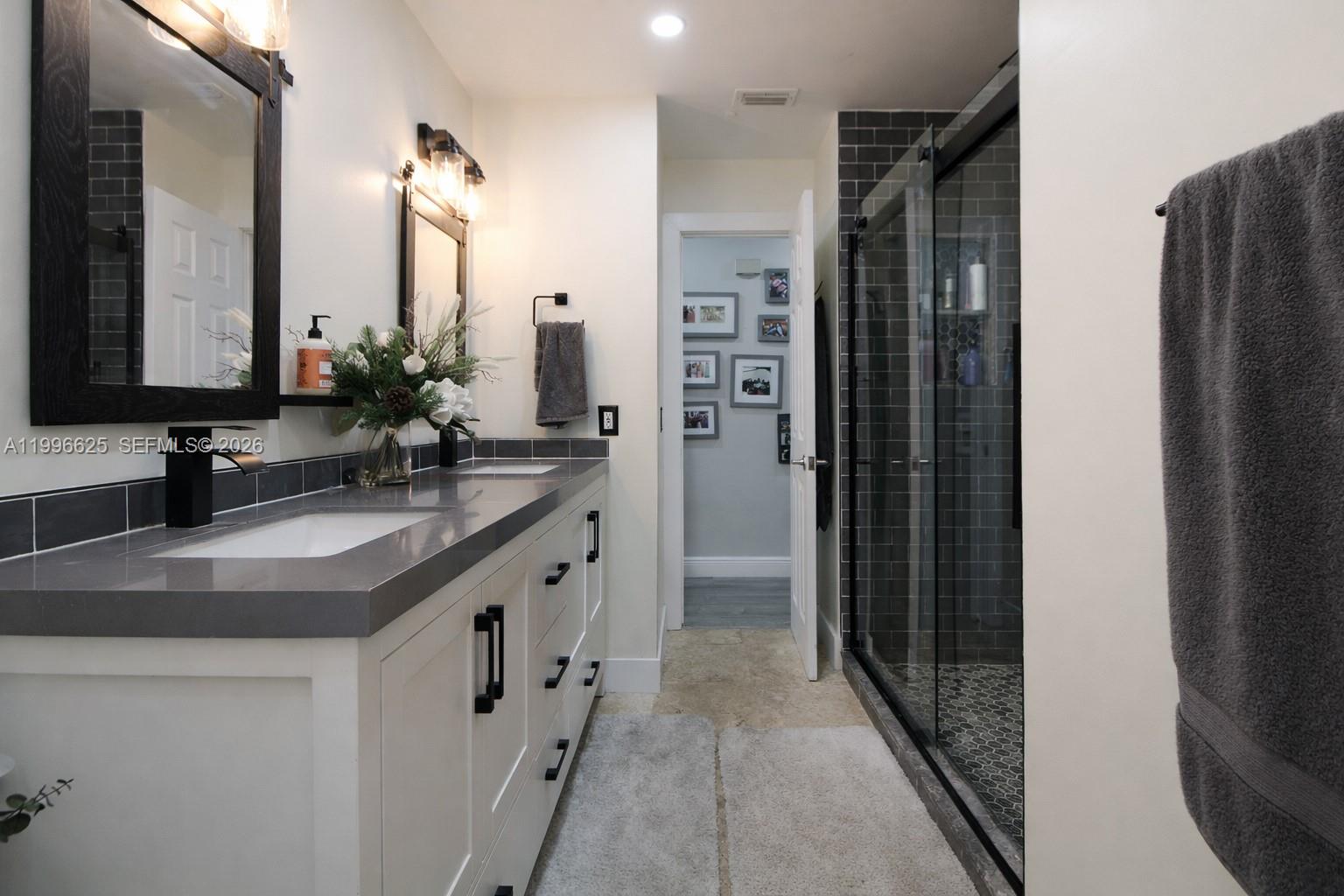 27420 Southwest 165th Avenue Homestead, FL 33031 - Photo 19 of 35 a bathroom with a granite countertop sink and a mirror