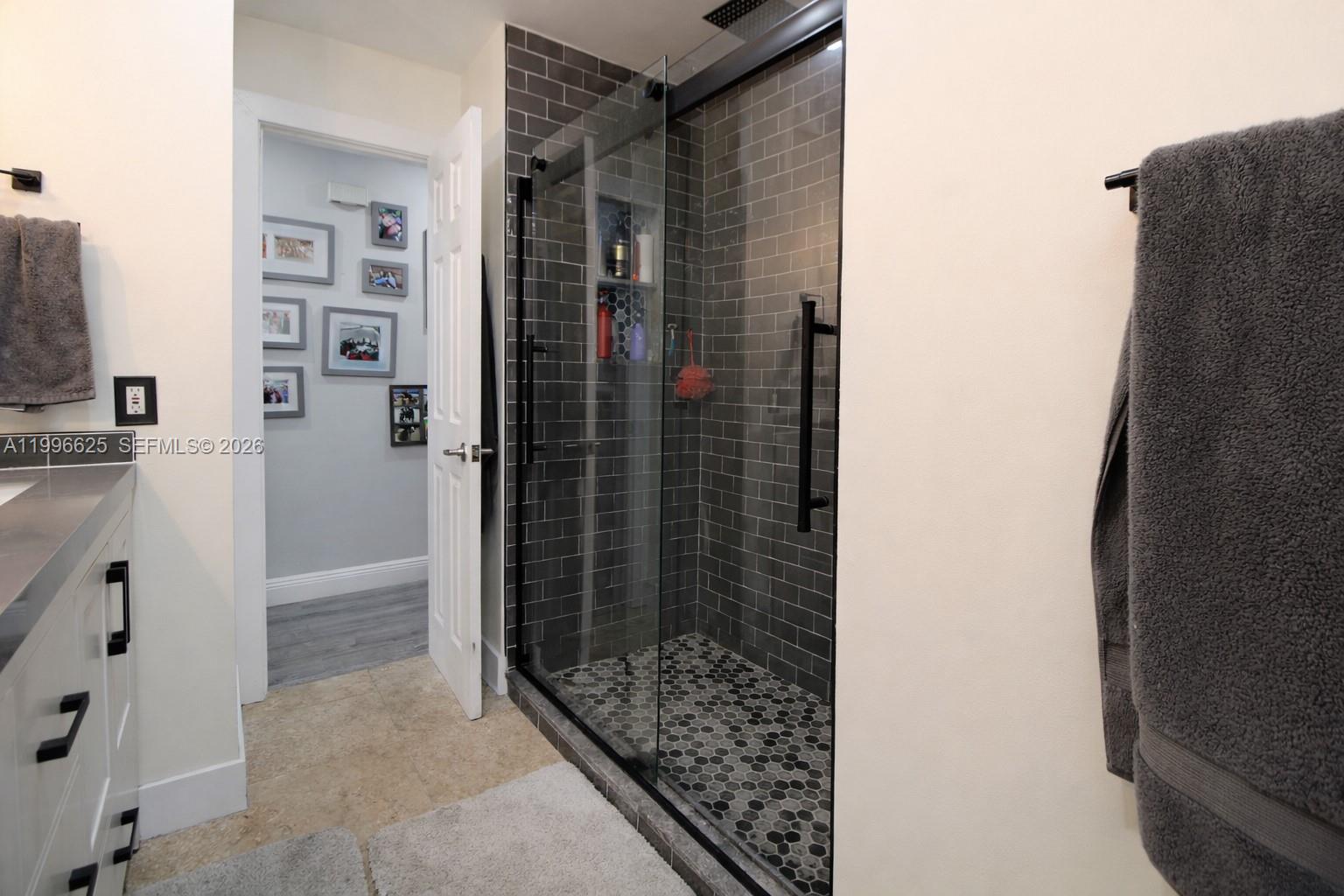 27420 Southwest 165th Avenue Homestead, FL 33031 - Photo 21 of 35 a bathroom with a shower