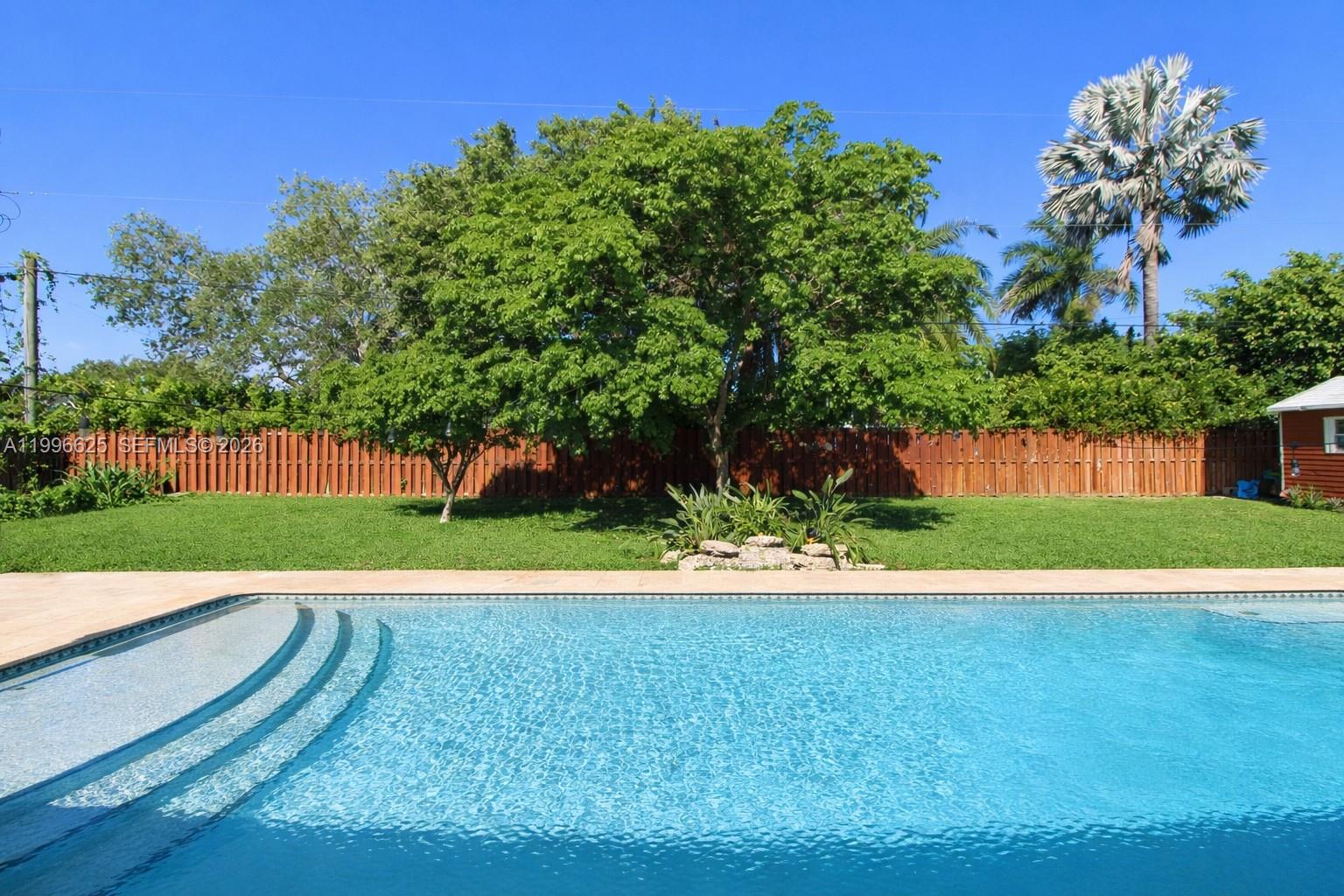 27420 Southwest 165th Avenue Homestead, FL 33031 - Photo 25 of 35 a view of a garden with a large trees