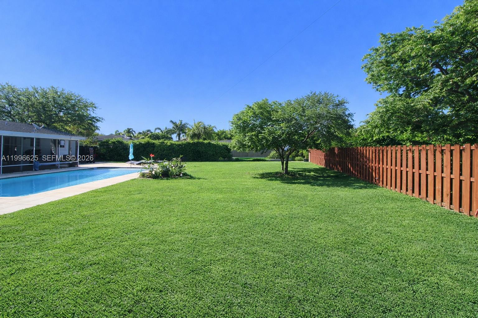 27420 Southwest 165th Avenue Homestead, FL 33031 - Photo 28 of 35 a view of a garden with trees