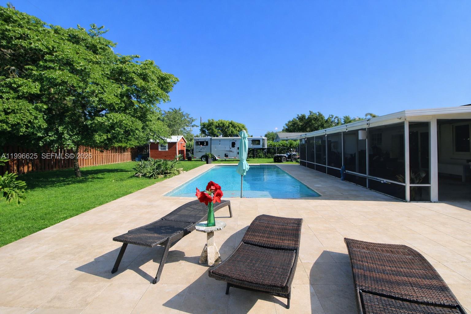 27420 Southwest 165th Avenue Homestead, FL 33031 - Photo 29 of 35 a view of a backyard with sitting area