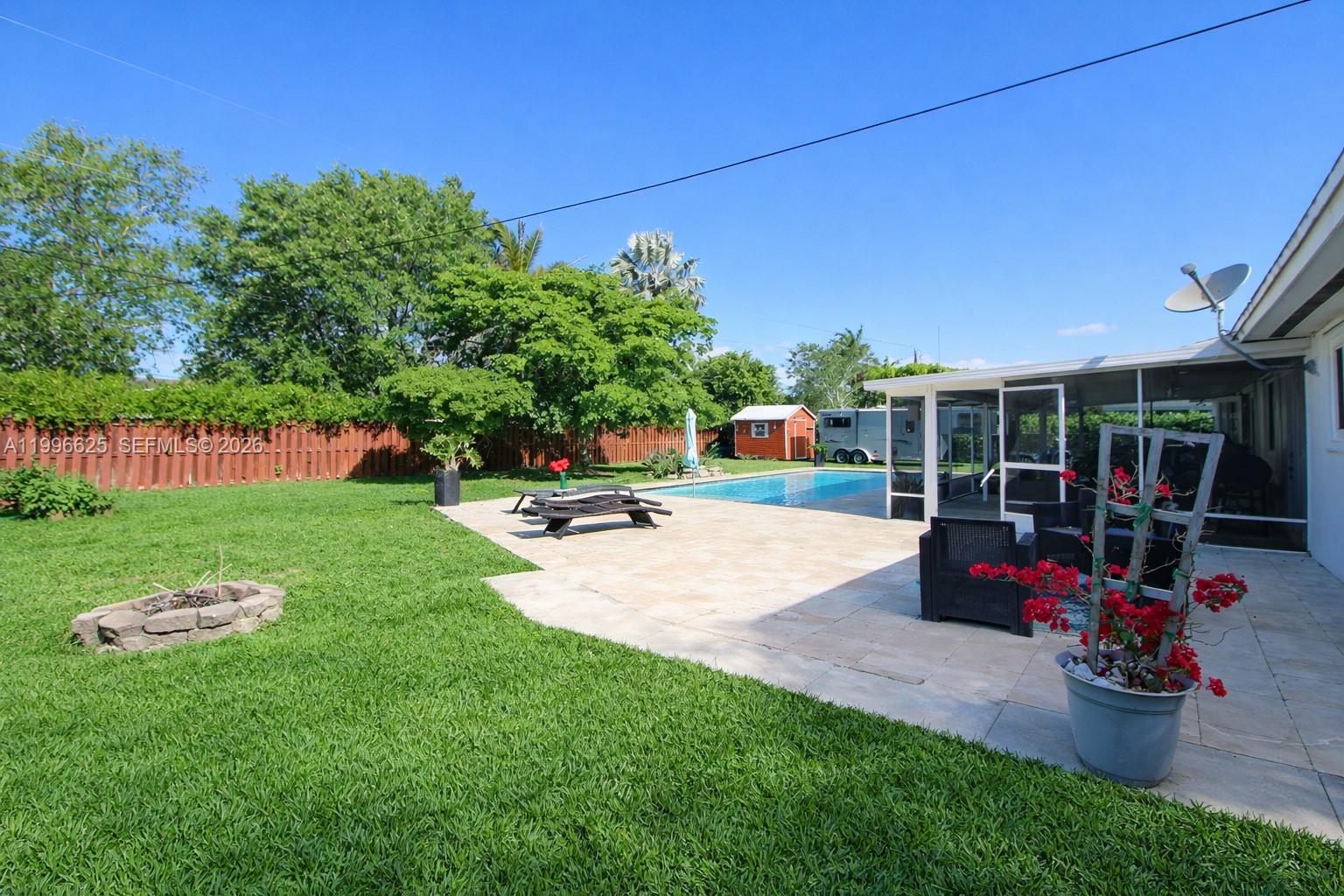 27420 Southwest 165th Avenue Homestead, FL 33031 - Photo 30 of 35 a view of a backyard with sitting area and slide