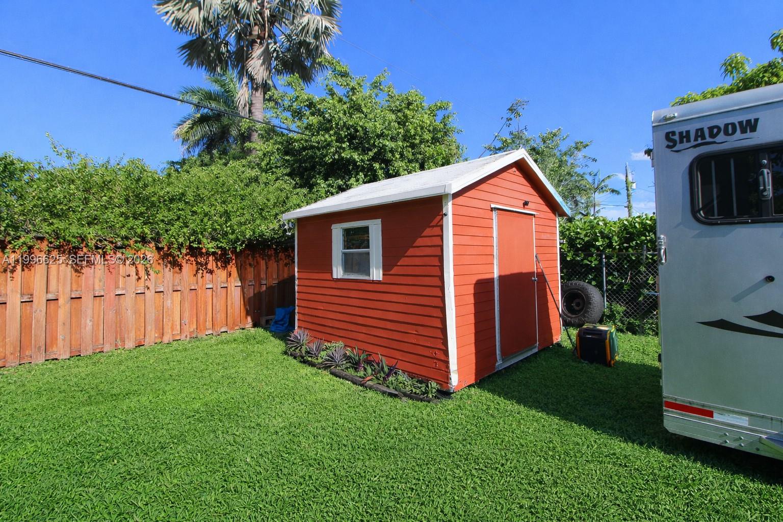 27420 Southwest 165th Avenue Homestead, FL 33031 - Photo 32 of 35 a view of front of house with a yard