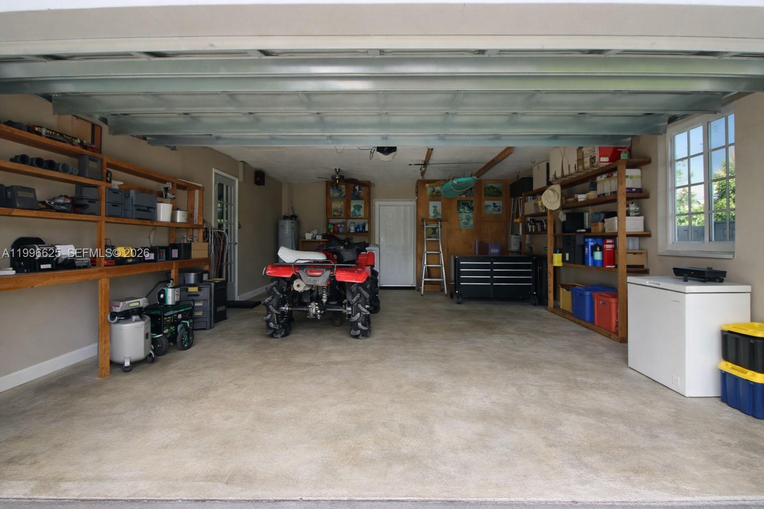 27420 Southwest 165th Avenue Homestead, FL 33031 - Photo 34 of 35 a view of a storage room with racks