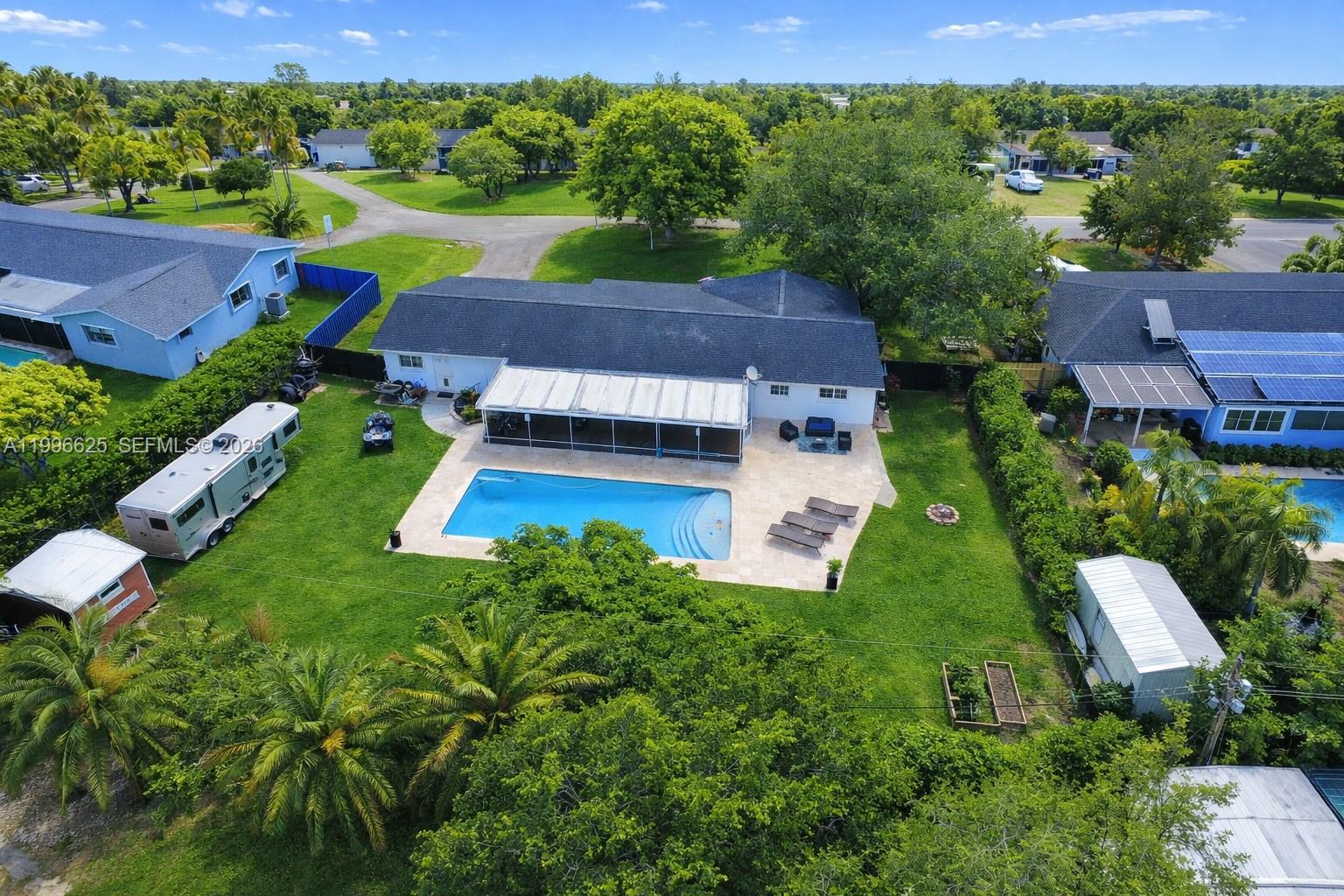 27420 Southwest 165th Avenue Homestead, FL 33031 - Photo 5 of 35 an aerial view of a house with garden