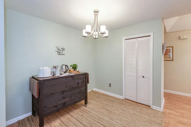 a view of a chandelier in wooden floor