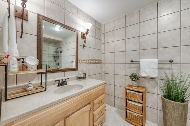 a bathroom with a sink and a mirror