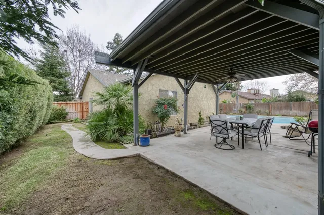 a view of a chairs and table in the patio