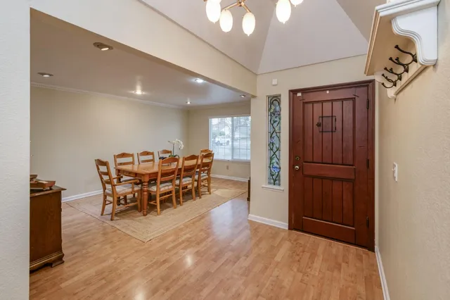 a dining room with furniture and window