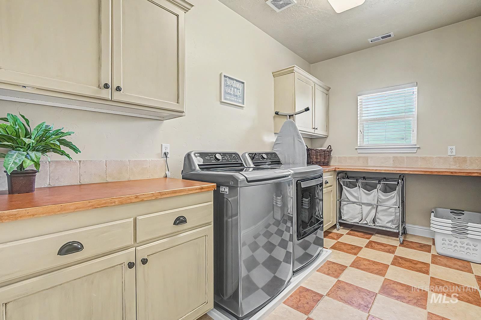 8751 West Rioja Street Star, ID 83669 - Photo 18 of 34 Dedicated utility space featuring checkerboard flooring
