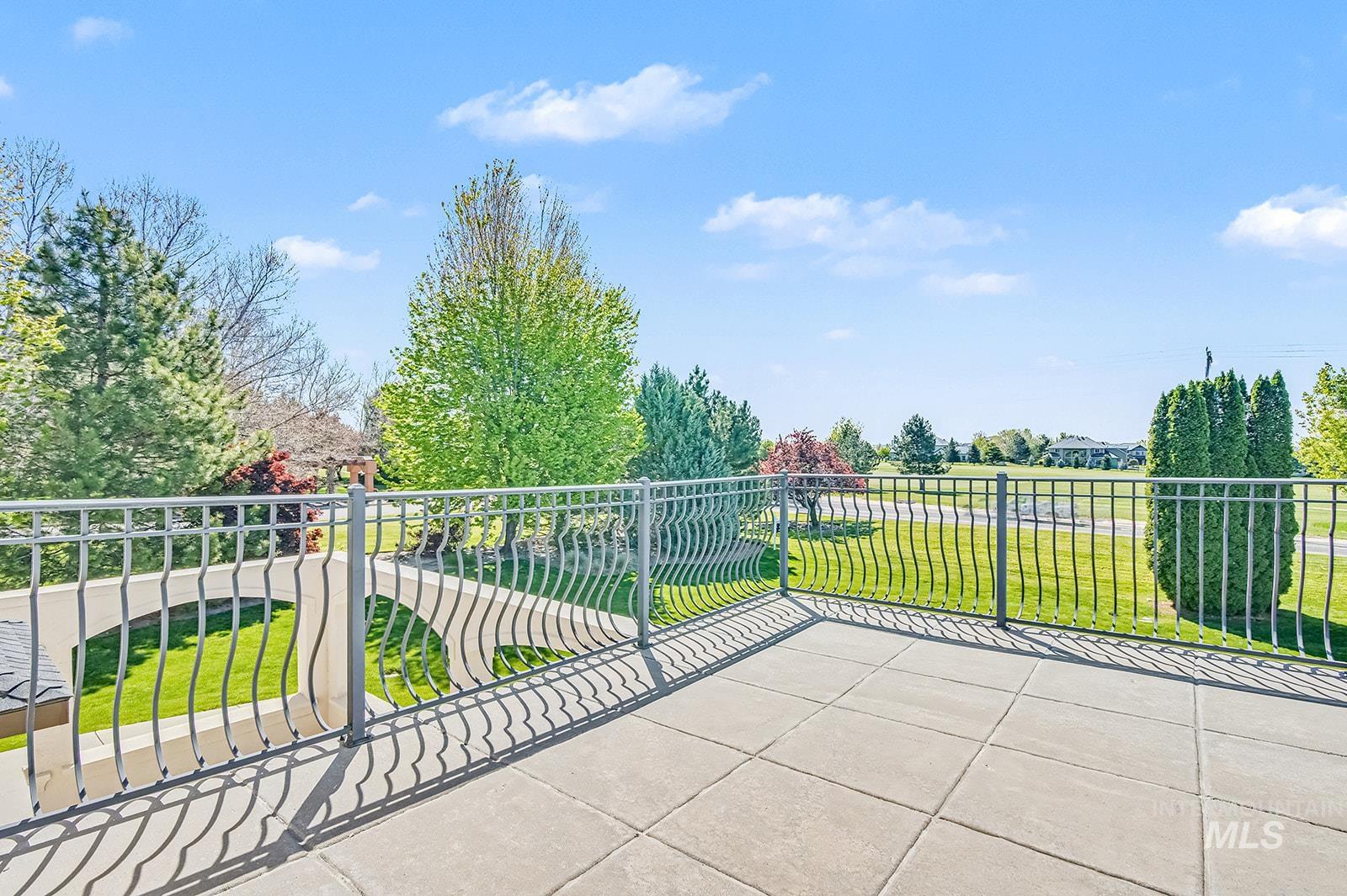 8751 West Rioja Street Star, ID 83669 - Photo 27 of 34 Outdoor patio featuring large square pavers and a decorative metal railing