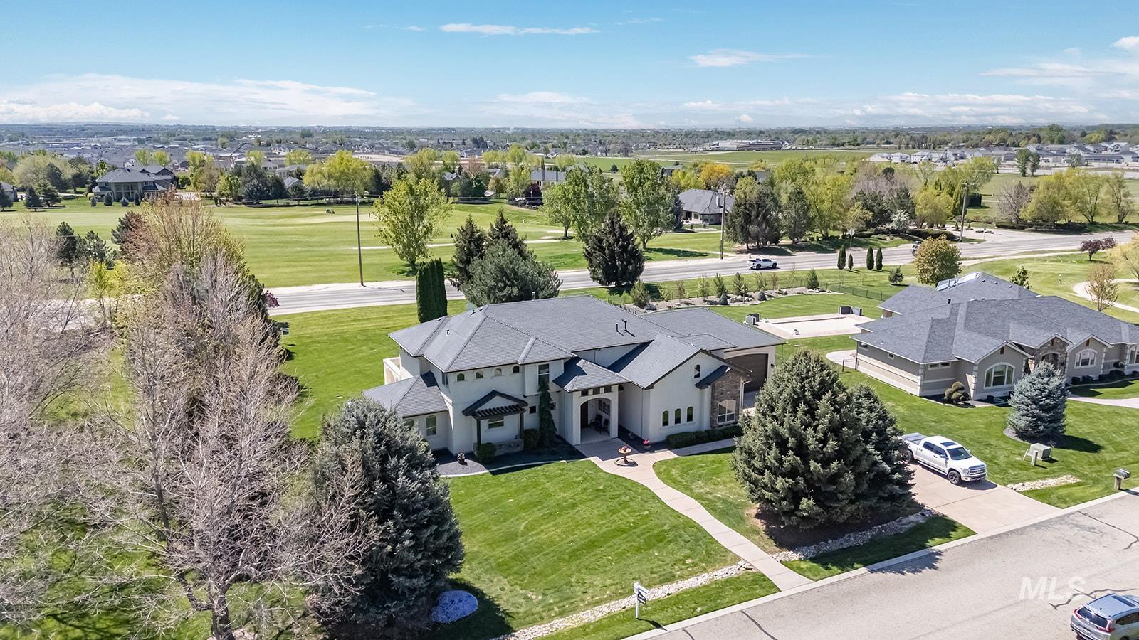 8751 West Rioja Street Star, ID 83669 - Photo 2 of 34 Contemporary stucco exterior with a gray shingle roof and an arched portico entry