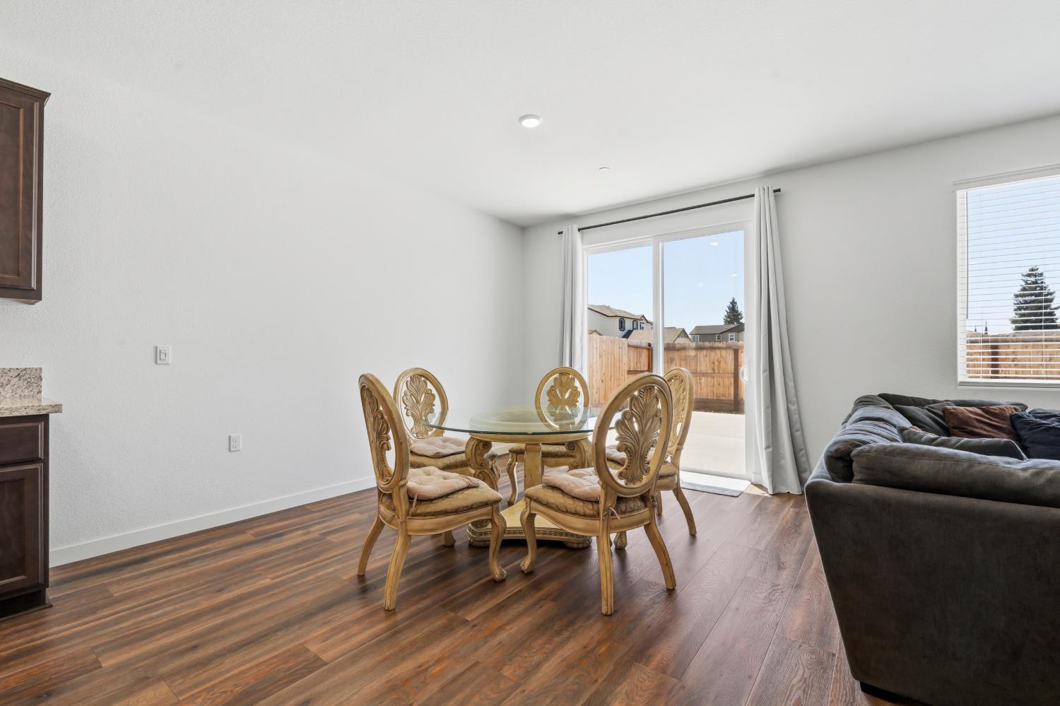 5713 Natalie Way Keyes, CA 95328 - Photo 7 of 30 a dining room with furniture and wooden floor