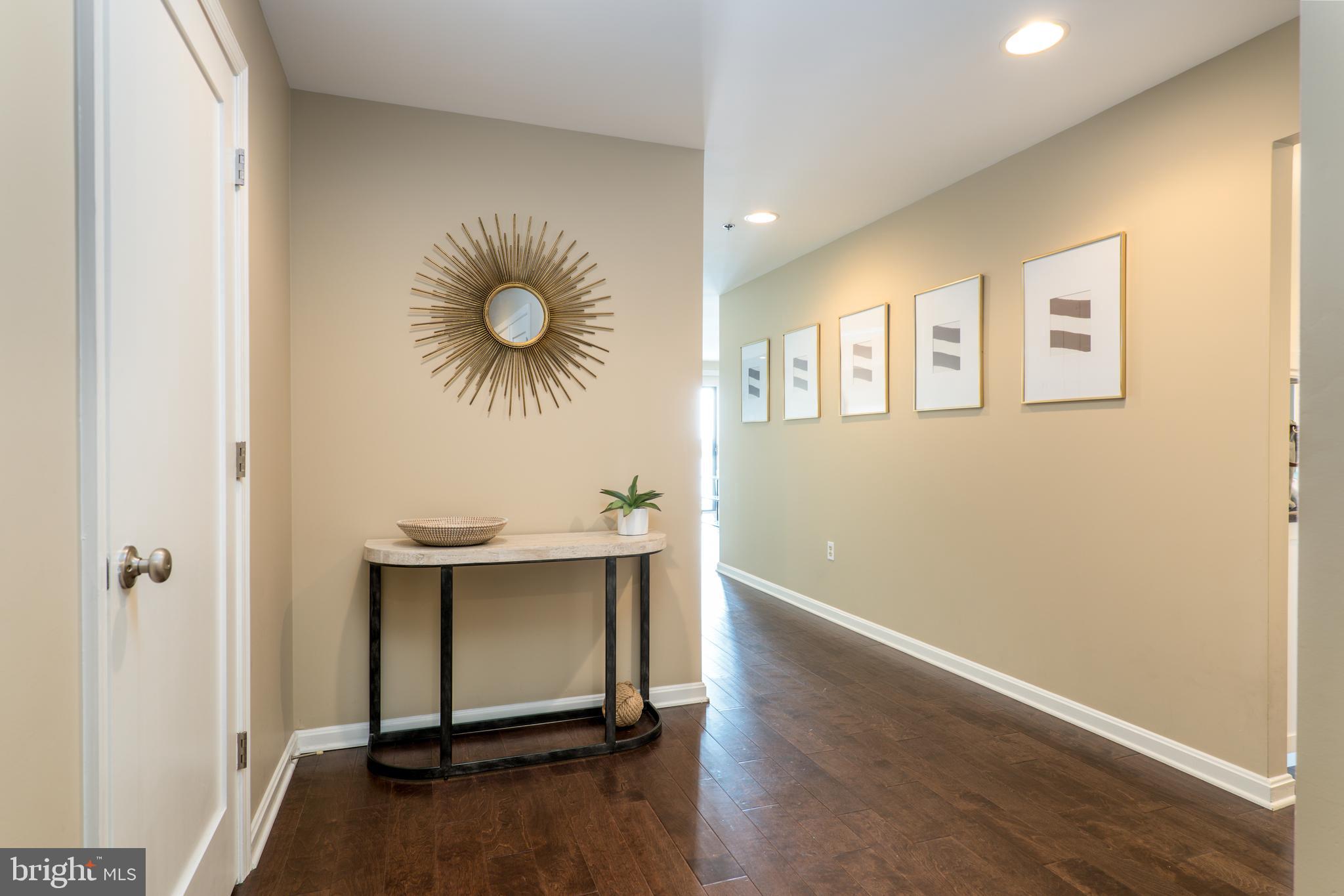 2702 Lighthouse Point East, Unit 637 Baltimore, MD 21224 - Photo 16 of 37 a view of a room with wooden floor and window