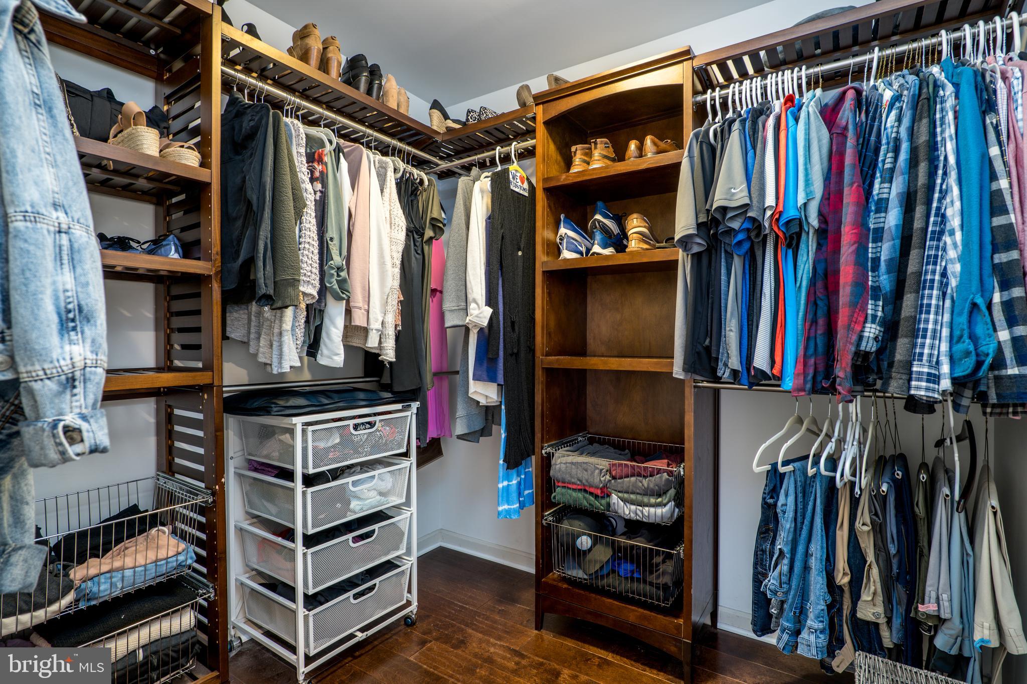 2702 Lighthouse Point East, Unit 637 Baltimore, MD 21224 - Photo 22 of 37 a view of walk in closet with clothes and shoes
