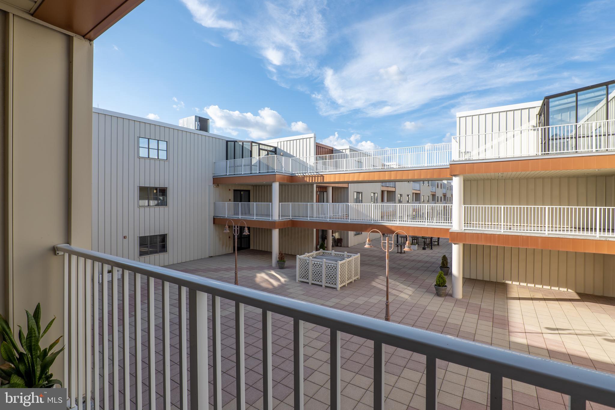 2702 Lighthouse Point East, Unit 637 Baltimore, MD 21224 - Photo 27 of 37 a view of a living room and balcony
