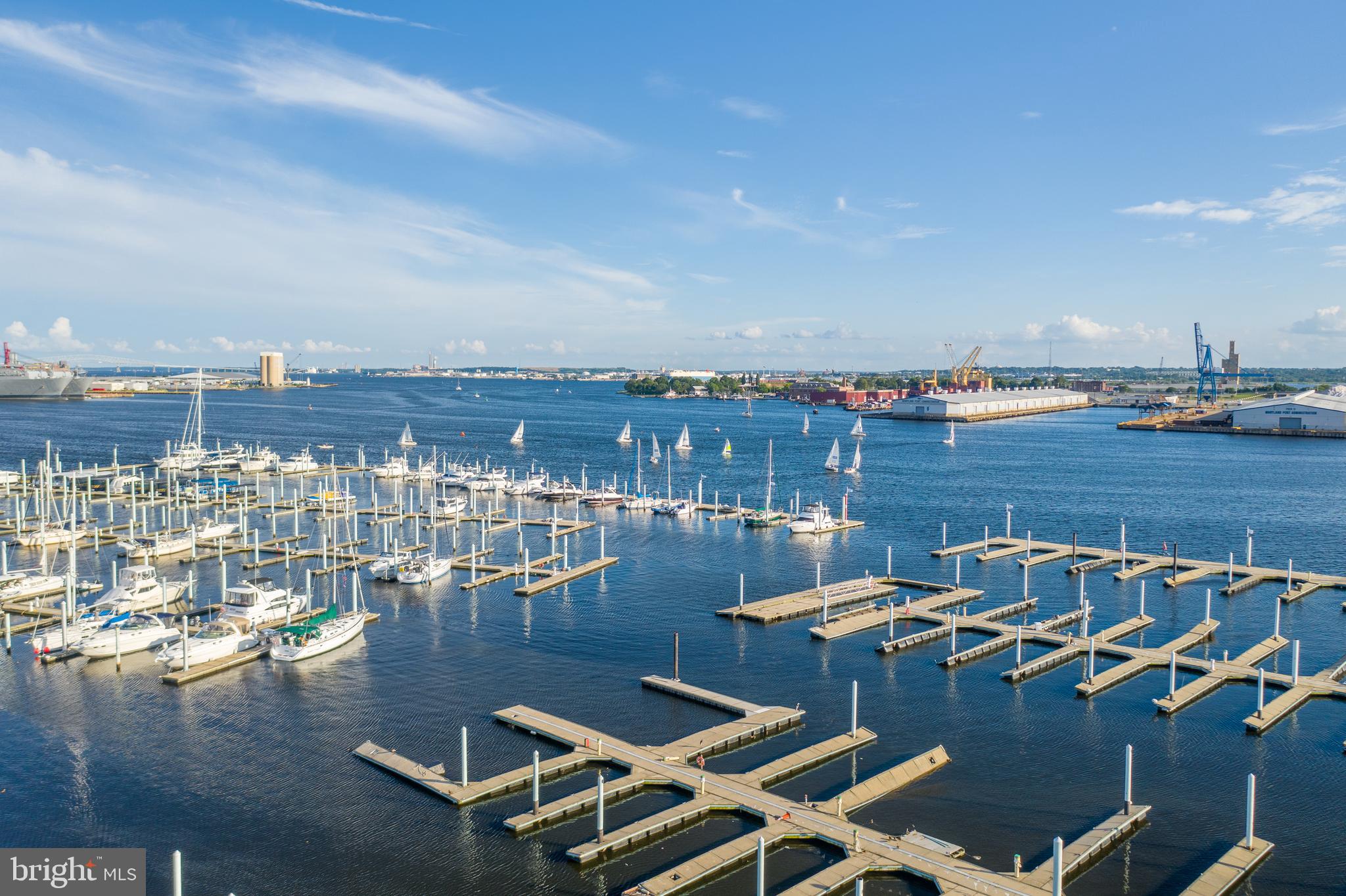 2702 Lighthouse Point East, Unit 637 Baltimore, MD 21224 - Photo 31 of 37 a view of a terrace with lawn chairs