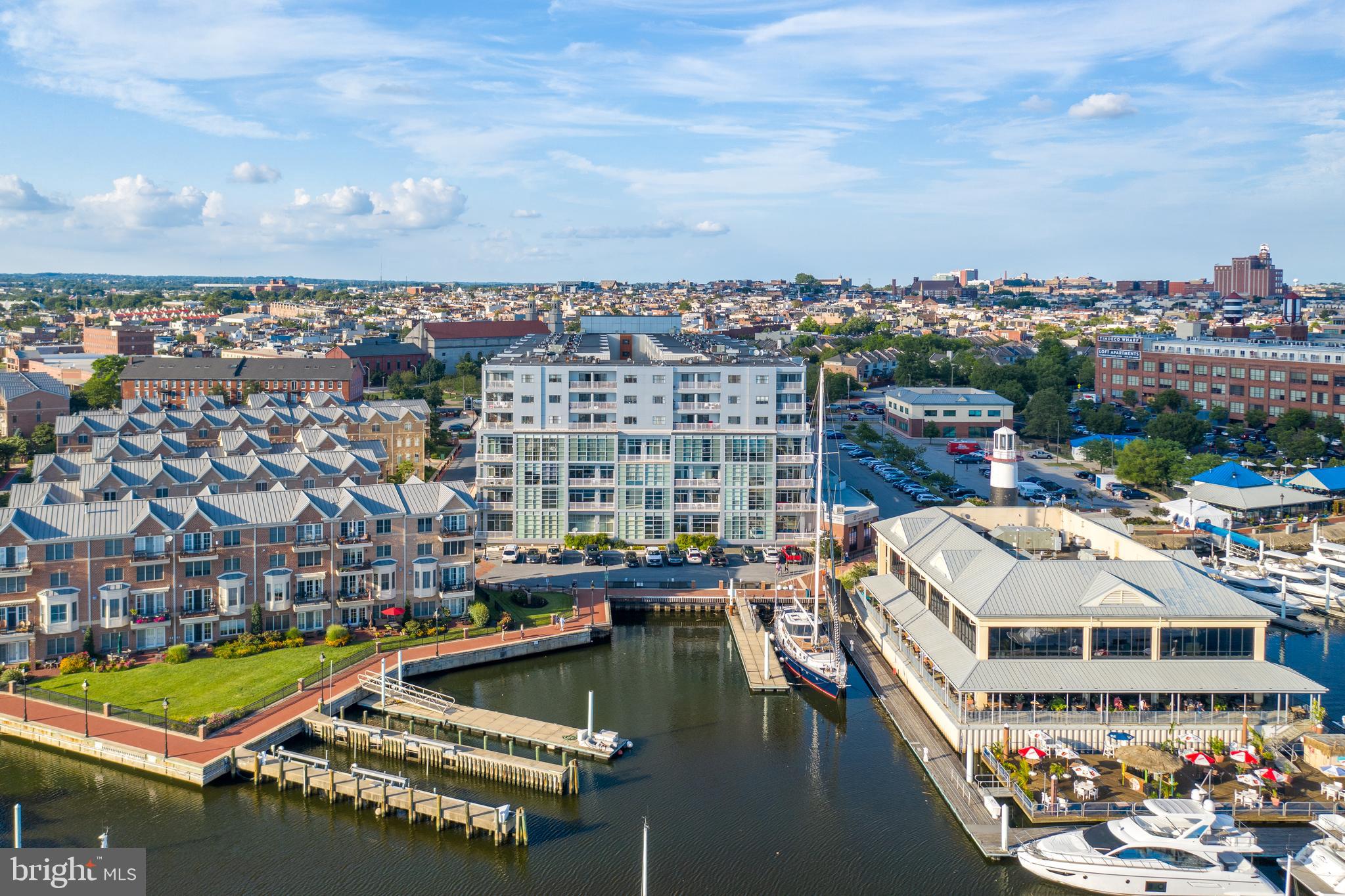 2702 Lighthouse Point East, Unit 637 Baltimore, MD 21224 - Photo 35 of 37 a view of a lake with building in front of it