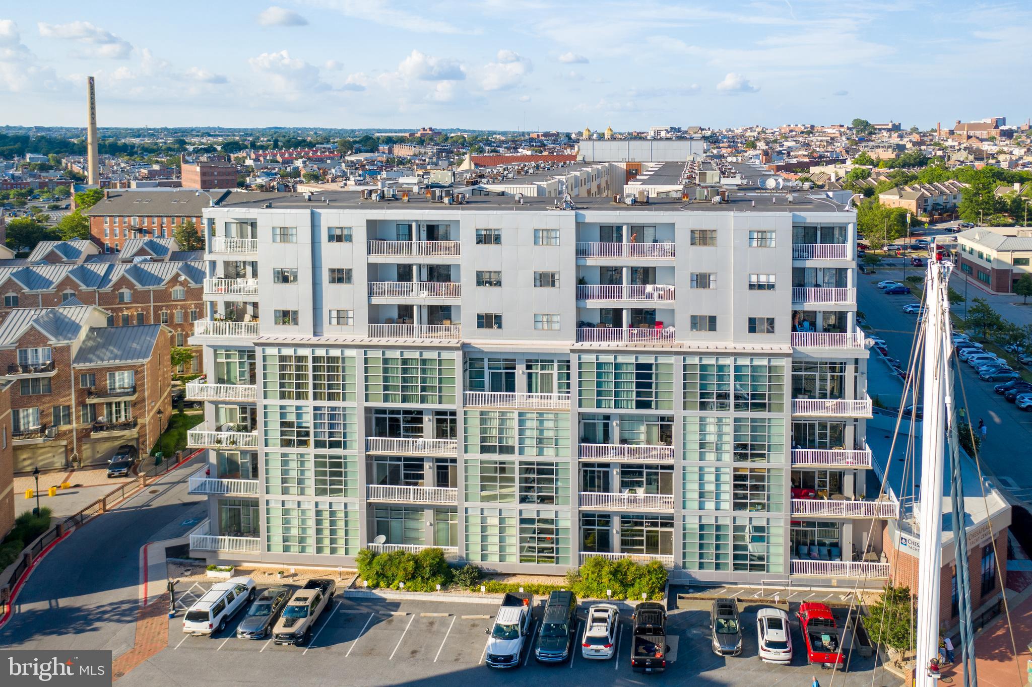 2702 Lighthouse Point East, Unit 637 Baltimore, MD 21224 - Photo 36 of 37 a front view of a building with glass windows