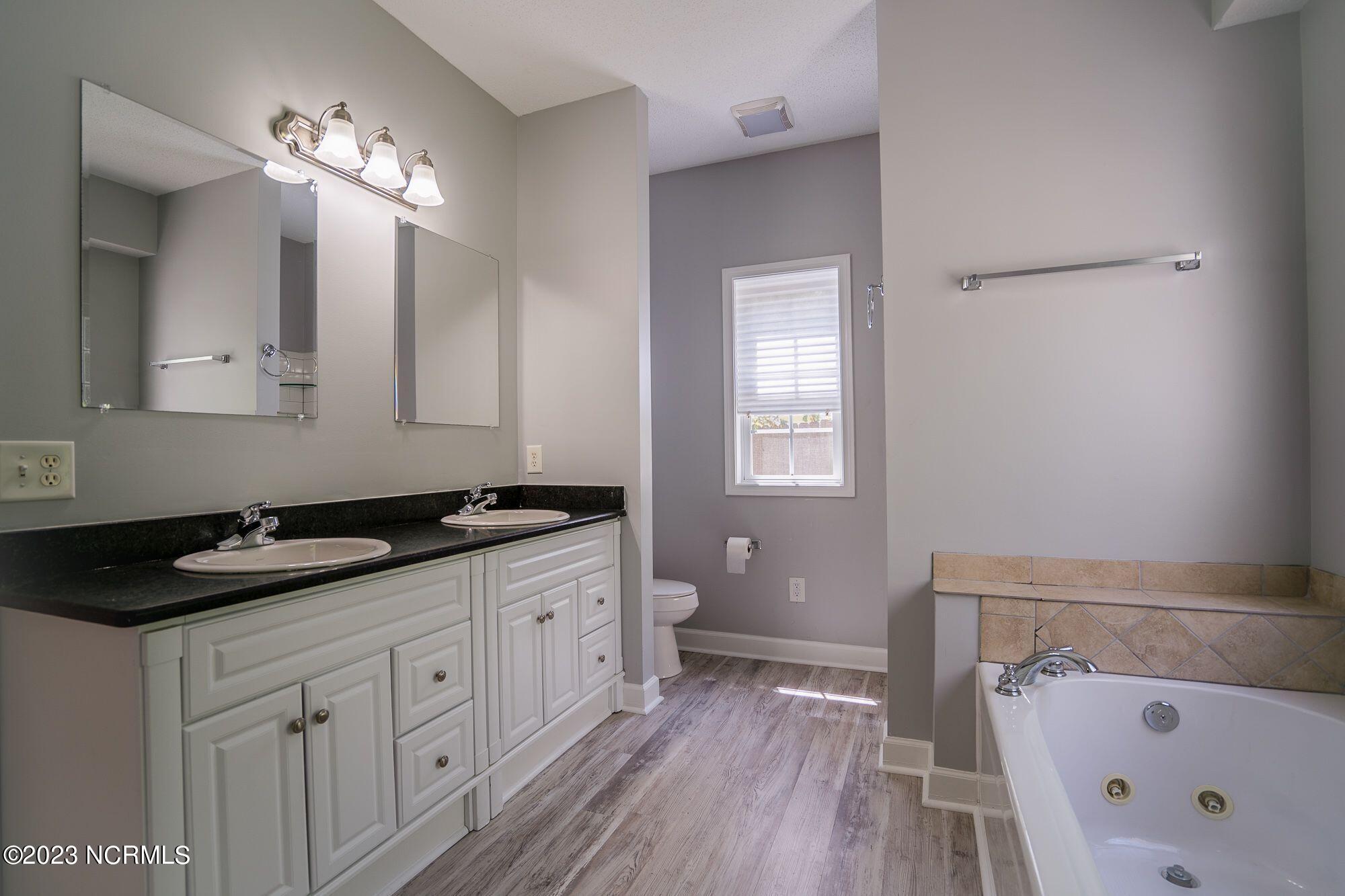10 Red Cedar Lane Pinehurst, NC 28374 - Photo 11 of 27 Primary bathroom with double sinks & granite countertops