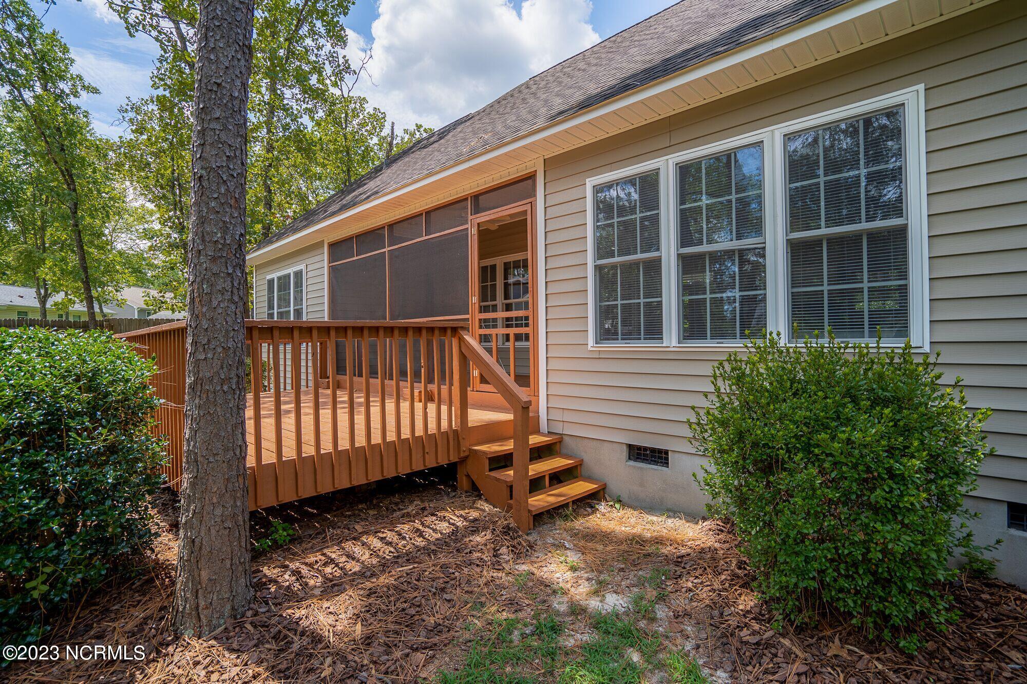 10 Red Cedar Lane Pinehurst, NC 28374 - Photo 2 of 27 Screen porch and deck