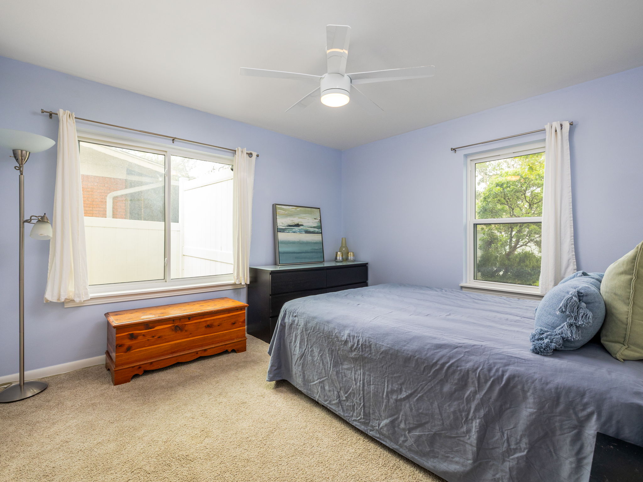 4710 Frontier Trail Austin, TX 78745 - Photo 22 of 32 a bedroom with a bed and a window
