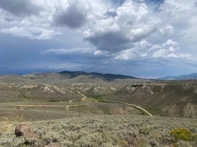 a view of a field of mountains and valleys