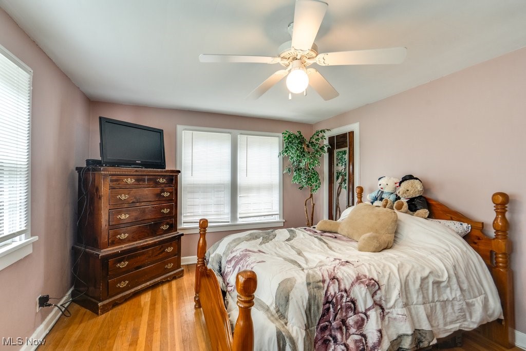 3709 Strandhill Road Shaker Heights, OH 44122 - Photo 18 of 25 Bedroom featuring light hardwood / wood-style floors, ceiling fan, and multiple windows