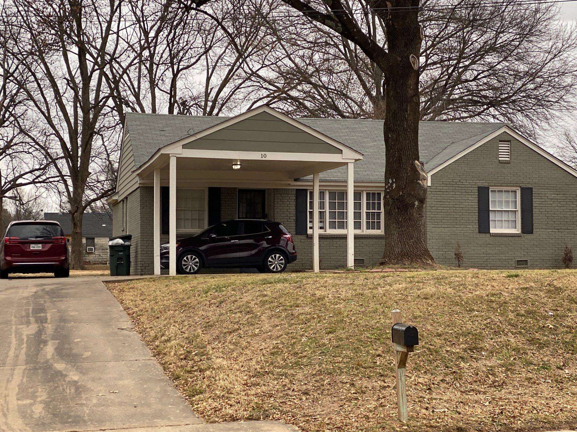 10 West Mitchell Road Memphis, TN 38109 - Photo 7 of 11 a view of a house with a yard covered in snow