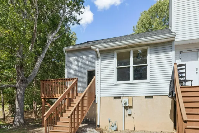 a view of a house with a balcony and stairs