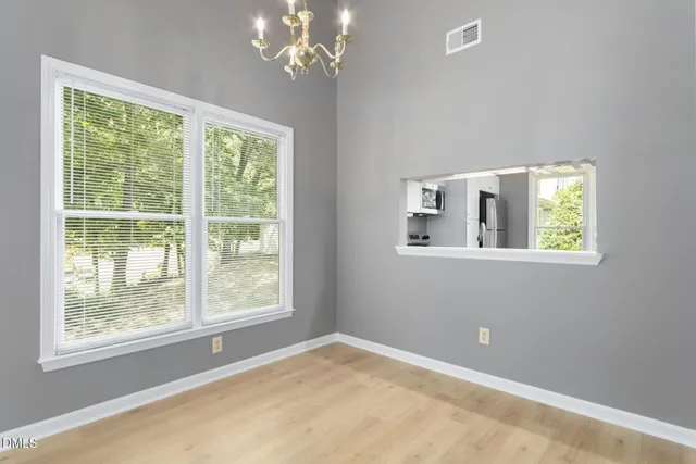 a kitchen with a refrigerator stove and sink